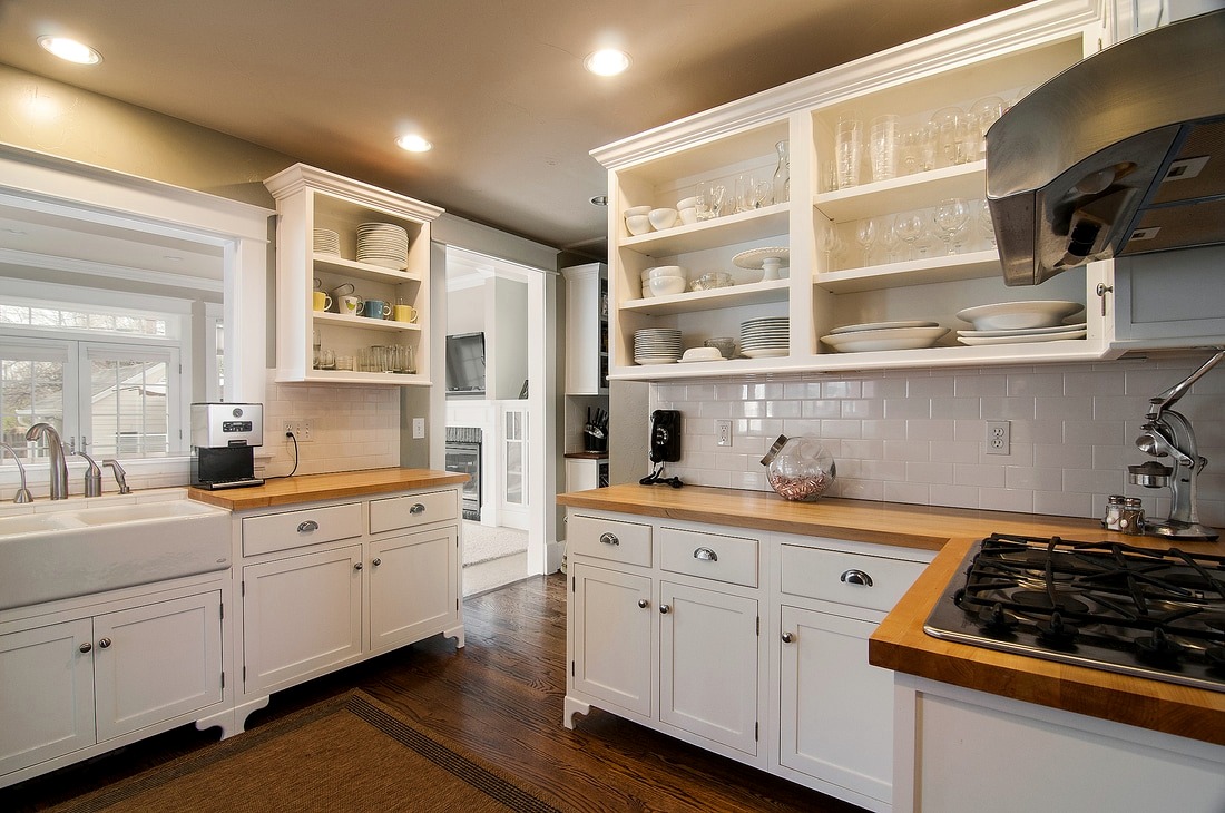 Real JML Interiors client kitchen with white open shelving and butcher-block counters